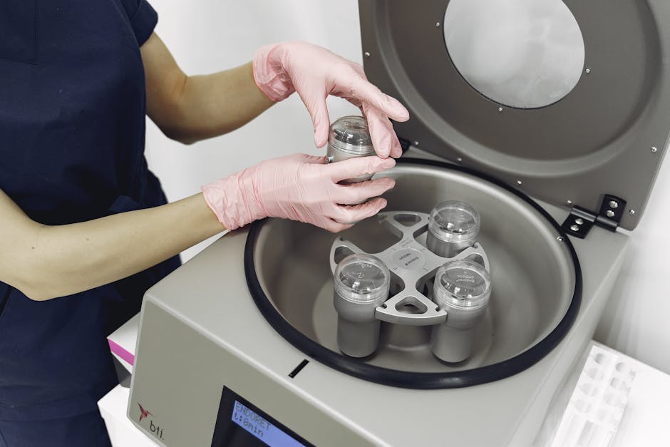 A female medical technician handles samples in a centrifuge, emphasizing precision and hygiene.